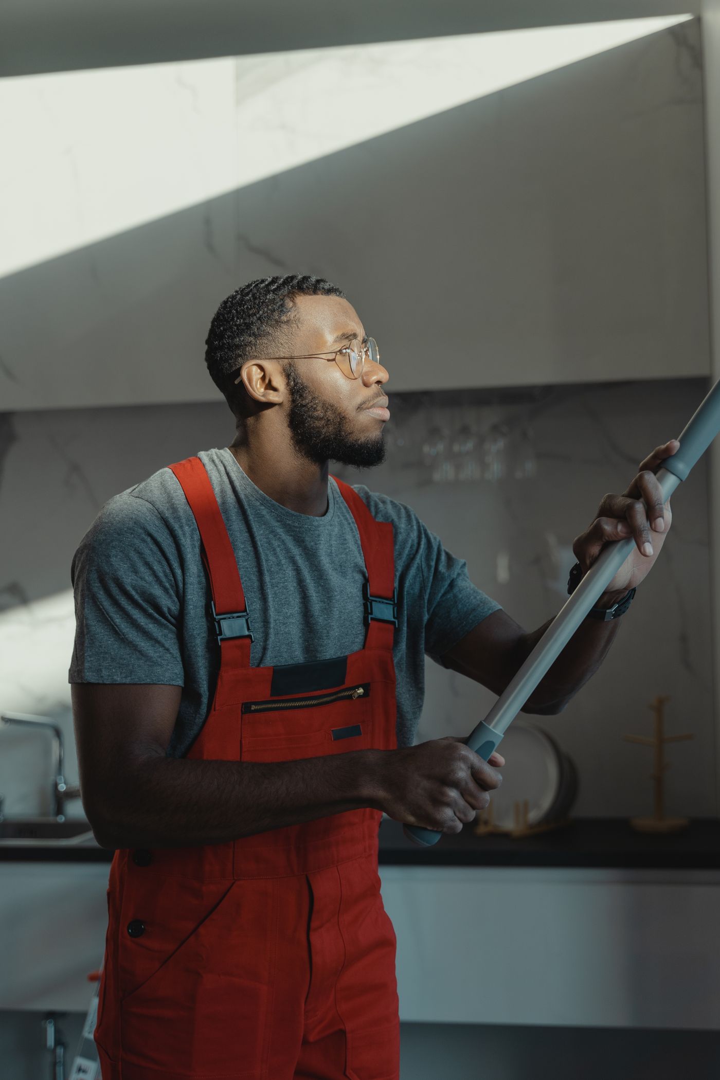 Professional cleaning team member preparing supplies in a commercial setting